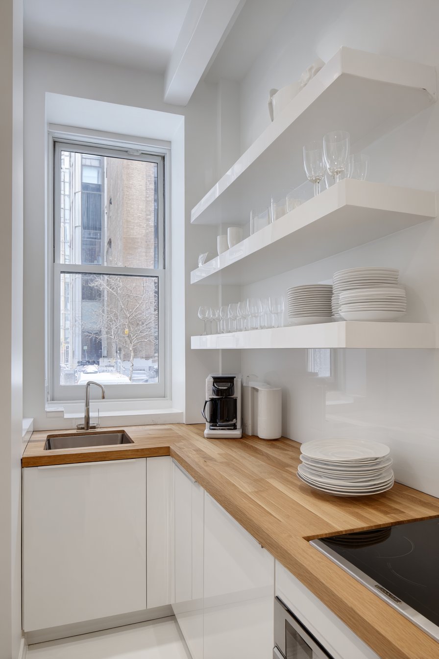 Floor-to-Ceiling White Brilliance with Butcher Block Warmth