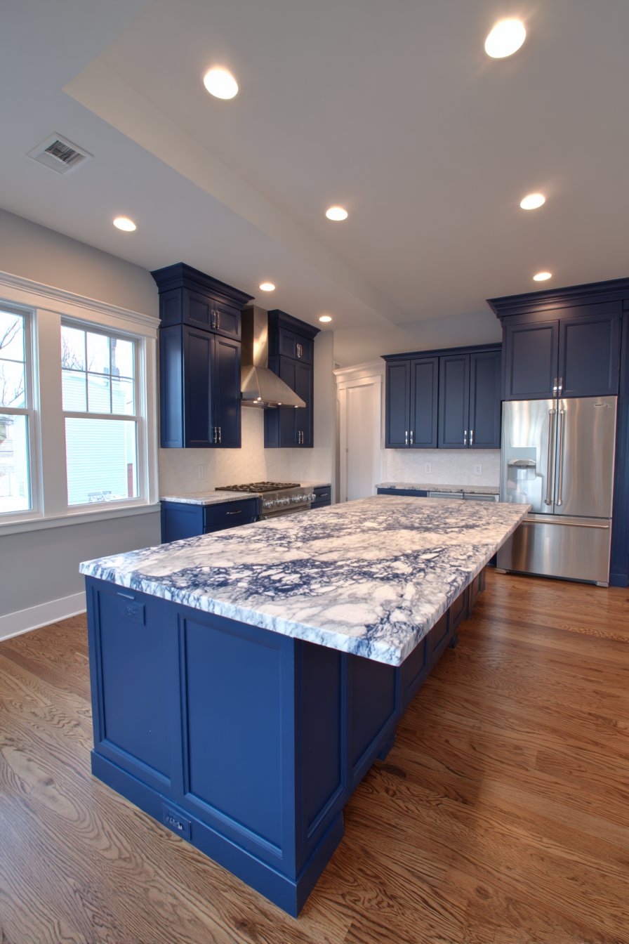 Transitional Sophistication with Raised Panel Navy Blue Kitchen Cabinets