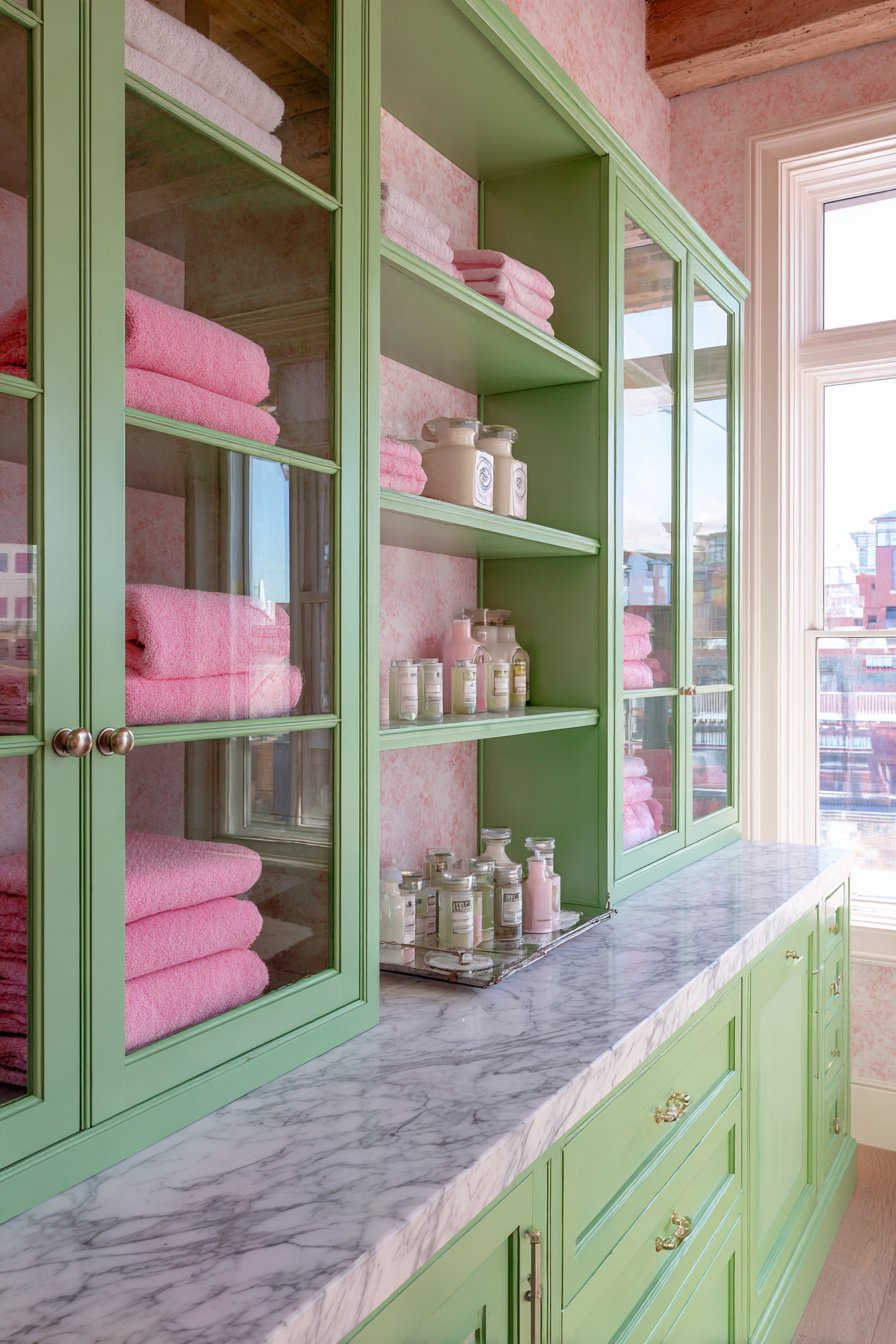 Practical Storage Solutions with Mint Cabinetry and Pink Accents