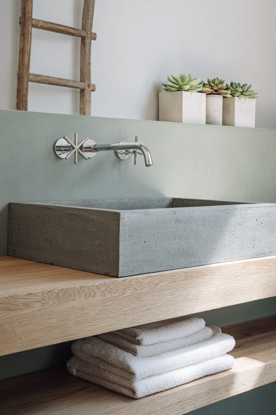 Refined Scandinavian Bathroom with Custom Concrete Sink