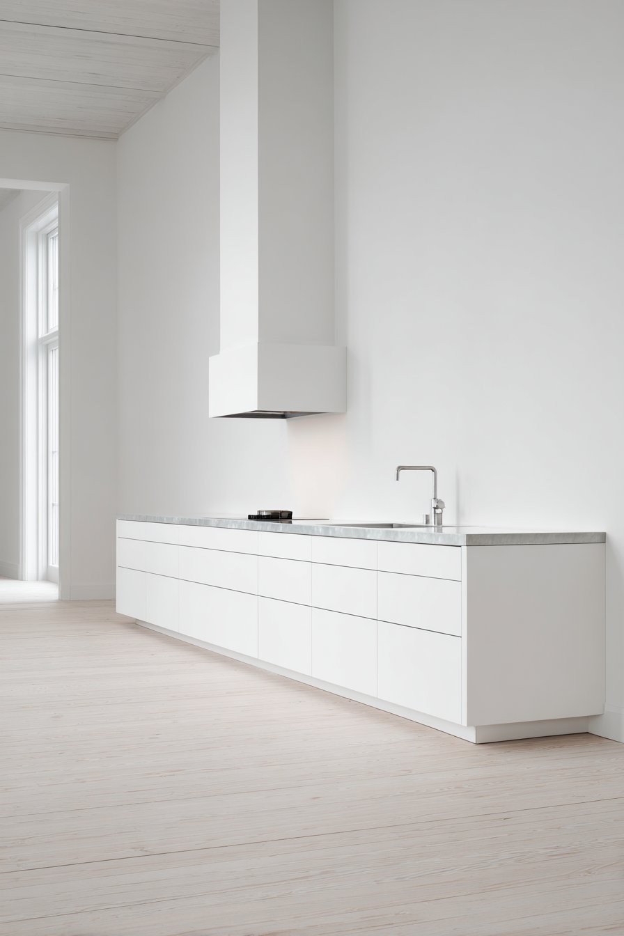 Minimalist Stainless Steel Kitchen with Seamless Surfaces