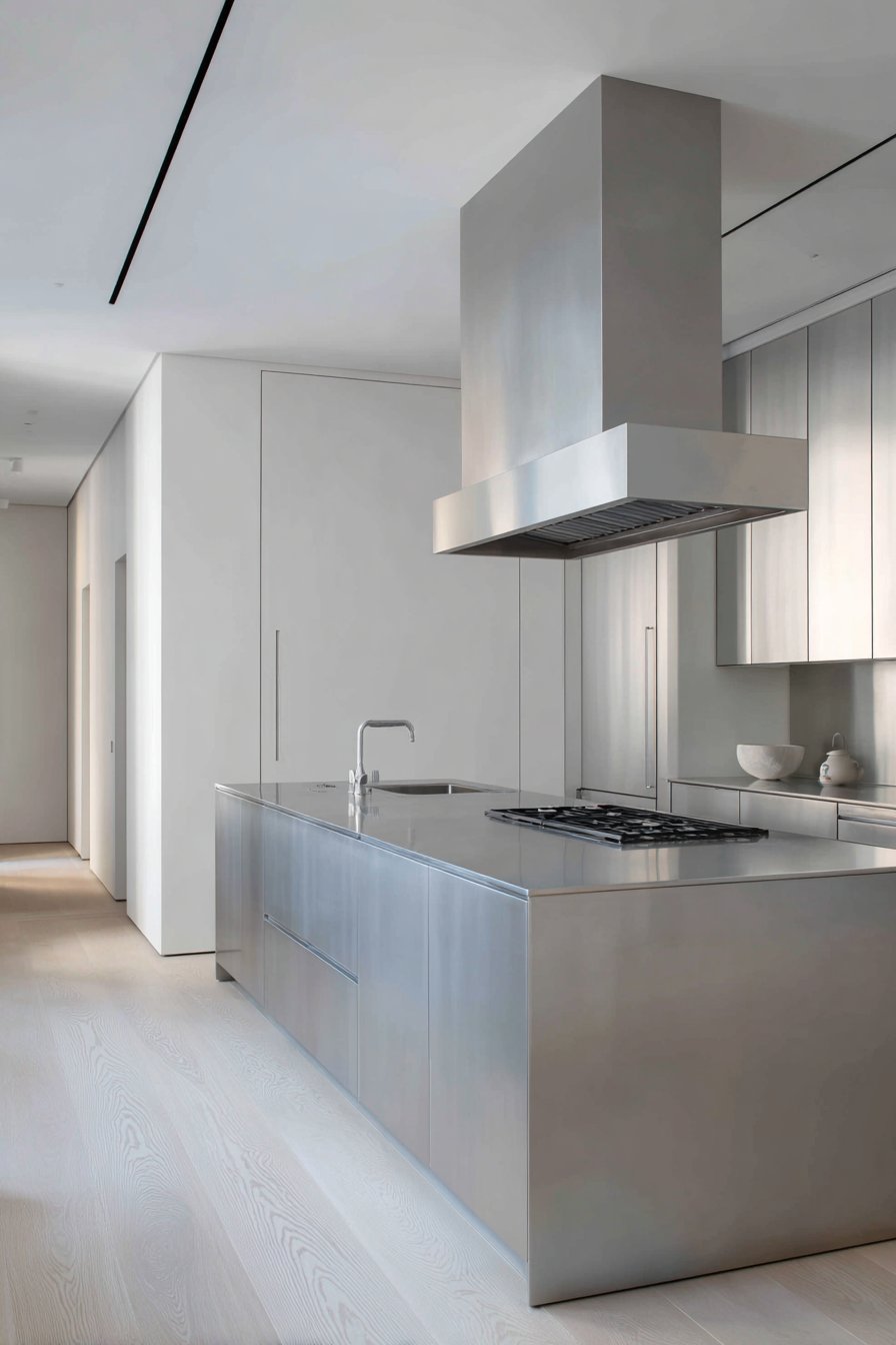 Minimalist Stainless Steel Kitchen with Seamless Surfaces