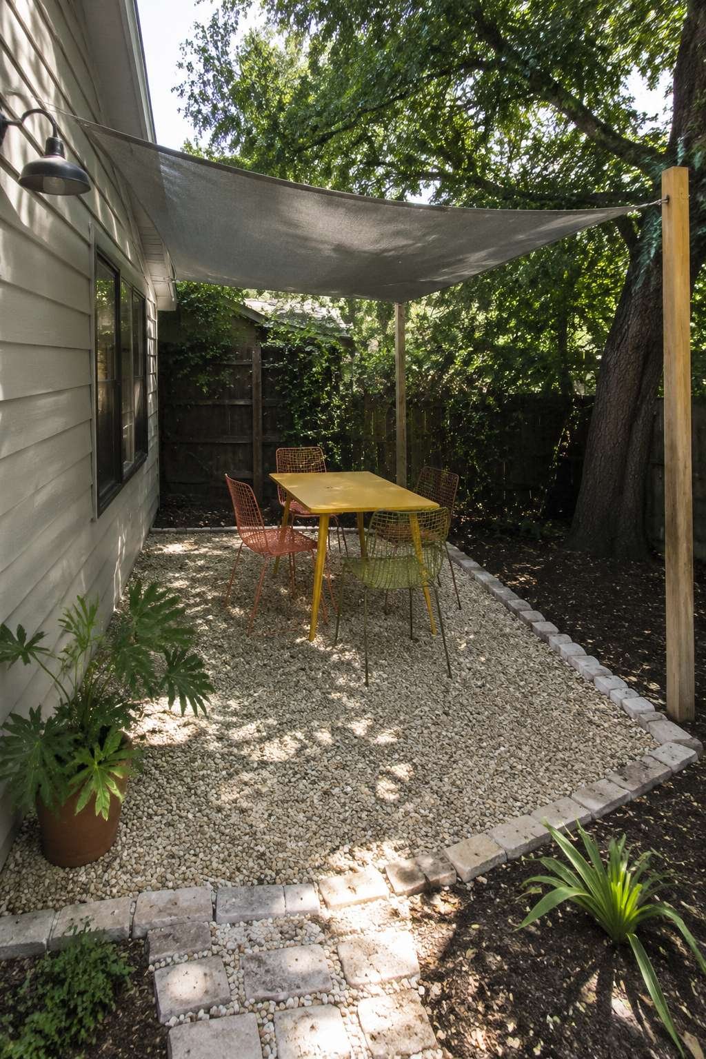 Budget Gravel Patio with Reclaimed Brick Edging